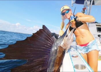 Girl catches a GIANT FISH taller then her deep sea fishing!