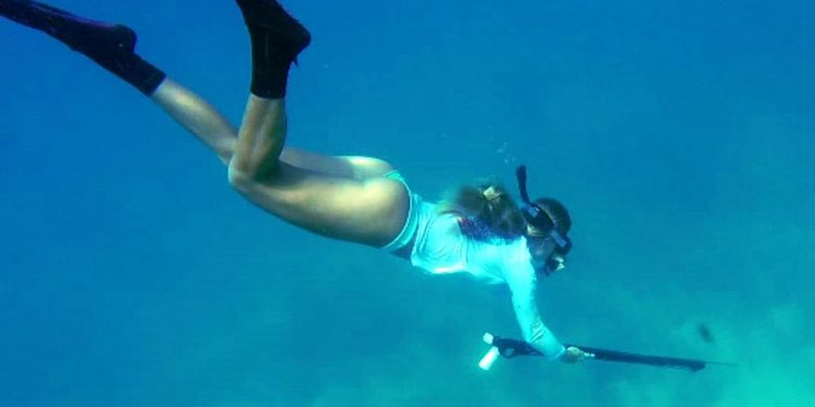 Girl Spearfishing and Diving in Florida Keys