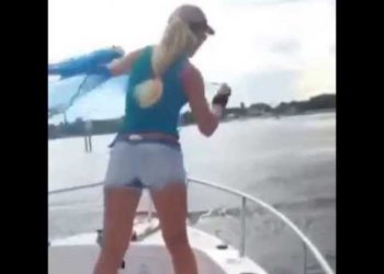 Girl Thows Cast Net from Boat for Bait, Palm Beach, Florida