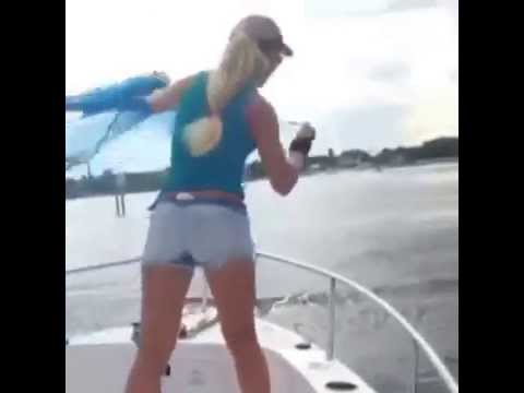 Girl Thows Cast Net from Boat for Bait, Palm Beach, Florida